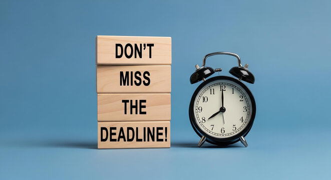 Don't miss the deadline text on wooden blocks next to an alarm clock