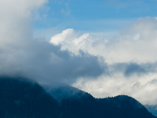 Moody Mountain Range Shrouded in Clouds Over Howe Sound, BC, Canada Landscape