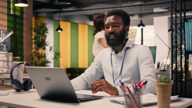 African american man, business intelligence, forecasting reports, modern office space. Charts and insights, organizational planning, objectives achievement, research and development.