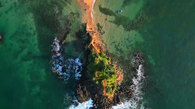 Aerial view of a tropical beach with clear turquoise waters