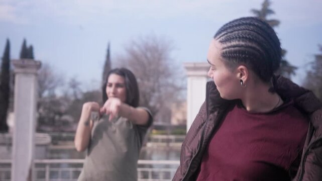Two women performing hip hop beatbox and freestyle dance