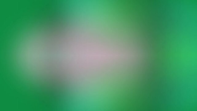 Blurry green background with a soft pink center patch in a close-up view with a dreamy mood.