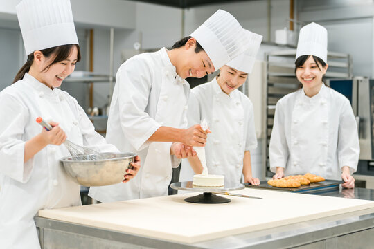Pastry chefs, cake makers, and pastry artisans making cakes and pastries in the kitchen
