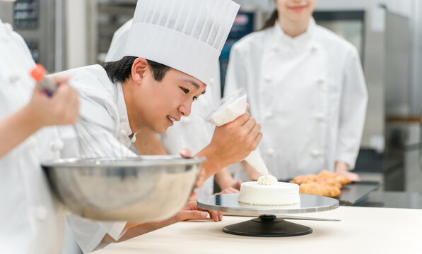 Pastry chefs, cake makers, and pastry artisans making cakes and pastries in the kitchen