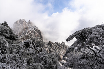 Huangshan, China: Atmospheric landscape of peak at the summit of the Yellow mountain, Mt Huangshan, in China in winter.