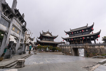 Huangshan, China: Entrance gate of the fortified wall with a temple in the Huizhou Ancient City dating from Ming dynasty in Anhui in China