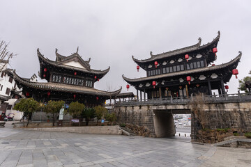 Huangshan, China: Entrance gate of the fortified wall with a temple in the Huizhou Ancient City dating from Ming dynasty in Anhui in China