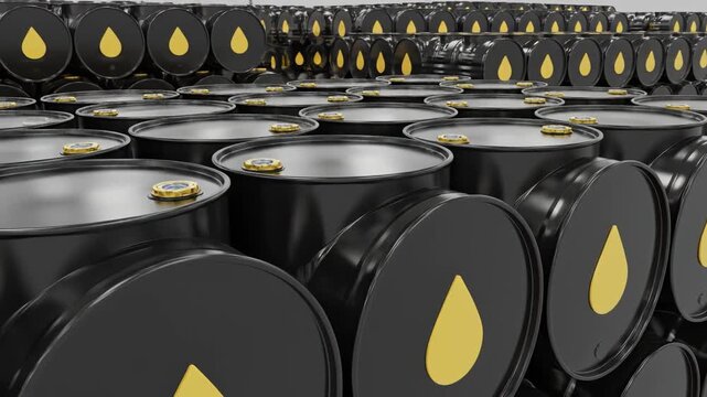Stacks of black oil barrels with yellow logos