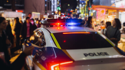 South Korean Police car and bus with "Police" logo, police cars and buses parked in government area of Seoul, police vehicle on duty maintain public order in the streets of downtown Seoul, South Korea © tsuguliev