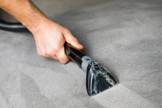 Professional cleaning of the upholstery on a sofa