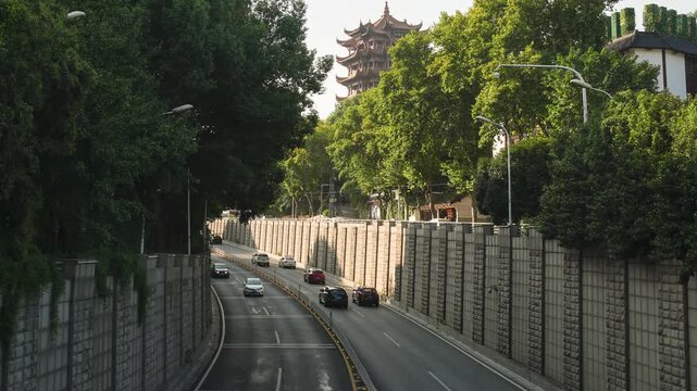 Ancient Chinese Pagoda Over City Road with Traffic