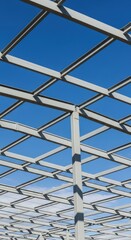 Metal Grid Structure Against Blue Sky.
