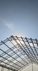 Metal Structure Under Construction Against Blue Sky.