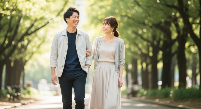 Happy Young Couple Taking a Relaxing Walk Together in Gentle Sunlight