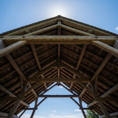 Wooden Roof Structure Under Blue Sky.