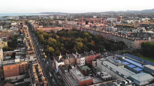 Merrion Square City Park and Dublin cityscape, Aviva Stadium and coastal on horizon. Drone