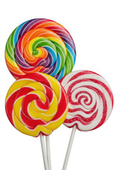Three large, highly detailed spiral gourmet lollipops (rainbow, peppermint, red/yellow) captured with a macro lens effect on a transparent high-key background with copy space. Concept of pristine
