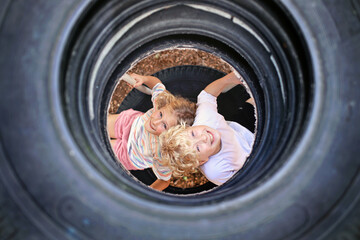 Cute, Happy Kids Playing at a Playground