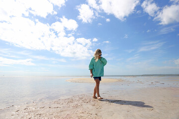 Young Tween Girl Walking on Beautiful Sandbar Beach on the Ocean