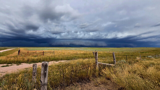 Storm is brewing in the distance, with thick gray circular cloud with high winds. May look like a tornado building, but here in this part of Wyoming, it doesn't happen very often.