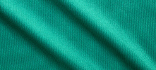 Fototapeta premium Green sports clothing fabric football shirt jersey texture close up