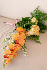 beautiful bouquet of roses with orchids and green leaves © Bangmabazz