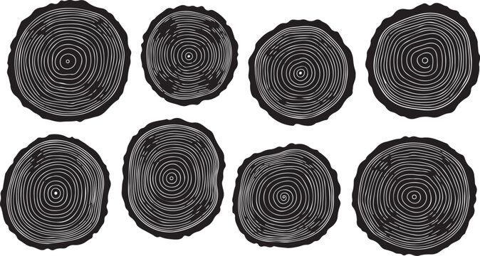 Eight black and white tree stump cross sections isolated