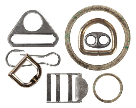 collection of metal hardware components for bags and straps, including a triangle ring, a d-ring, a roller buckle, a side release buckle, and a strap ring, isolated on transparent background