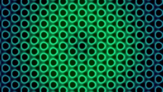 Aerial view of a dense pattern of green circles forming a gradient background with varying shades and opacity