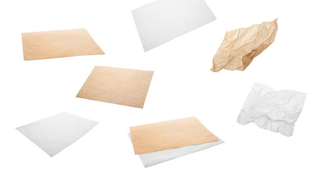 a dynamic arrangement of baking parchment and crumpled parchment paper pieces scattered across a transparent background, showcasing culinary supplies.