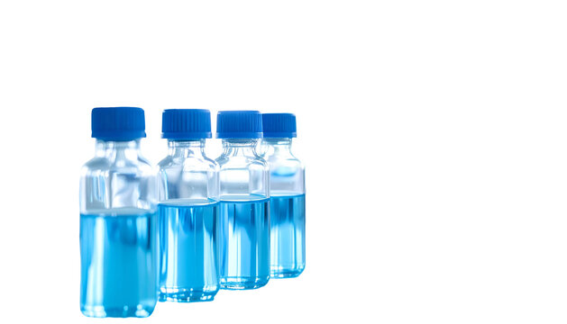 Row of small clear glass vials filled with blue liquid, capped, isolated on black