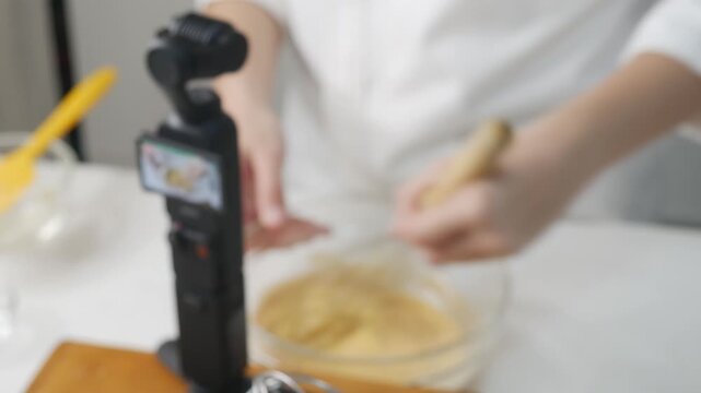 Food Content Creator Recording Cooking Video with Action Camera and Studio Lighting Setup
