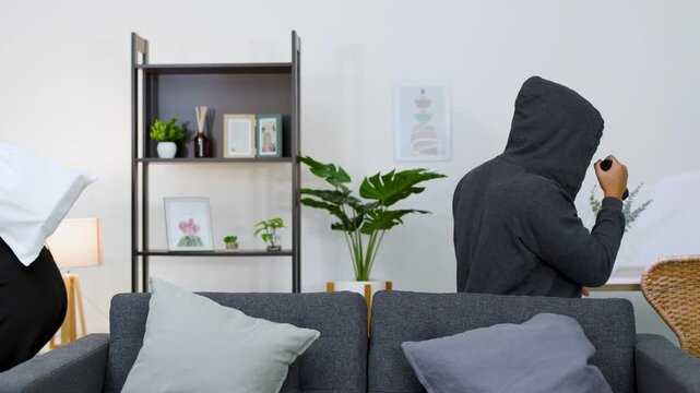 Two Masked Burglars Reveal Their Identities and Laugh After a Living Room Robbery