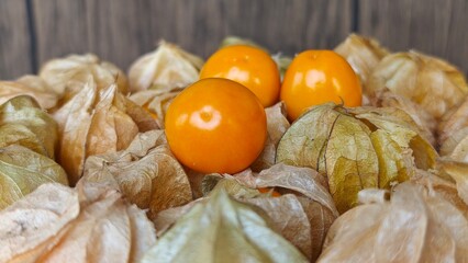 Cape gooseberry on wooden background.