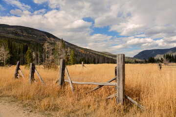 Autumn Mountain Landscape with Wooden Fence Foreground
