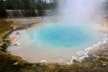 Colorful Geothermal Hot Spring with Steam and Mineral Deposits