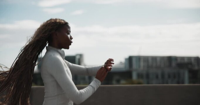 Running, check watch or black woman in city for fitness, timer or heart rate for cardio health. Workout, jog or person with wristwatch for pace, VO2 max or exercise with performance metrics on bridge