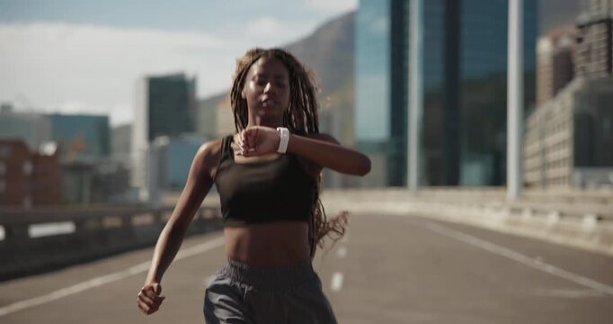 Running, smart watch and black woman in city for cardio health, timer or heart rate for fitness. Workout, jog and person check wristwatch for pace, track performance and runner exercise on bridge