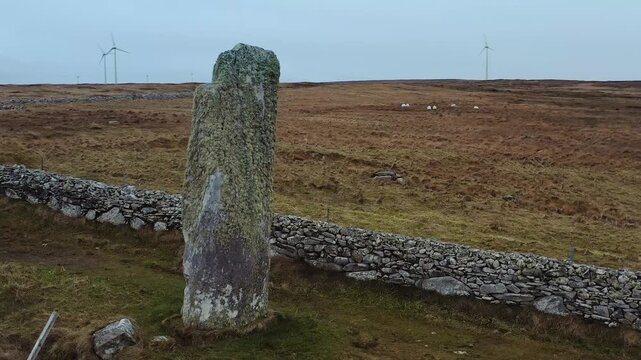 Drone shot panning around Clach an Trushal standing stone on the Isle of Lewis.