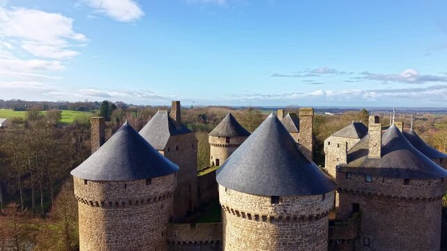 Historic fortified castle of Lassay-les-Ch&acirc;teaux with its distinctive round towers in Mayenne, France. Aerial drone ascending