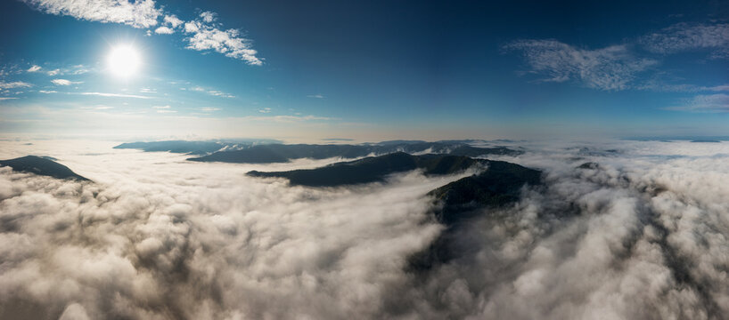 Southern Urals in summer: Southern Kraka ridge, aerial view. Morning fog in the mountains.