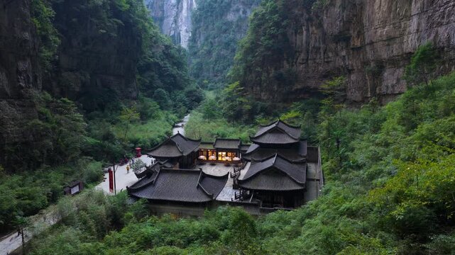 Old And Historic Tianfu Posthouse Within The Wulong Three Natural Bridges In China. - aerial shot