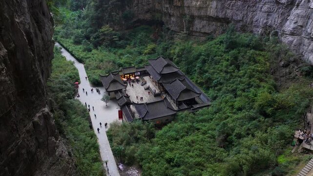 Three Natural Bridges -Tianfu Post House In The Sinkhole Within The Wulong Karst National Geology Park In China. - aerial shot