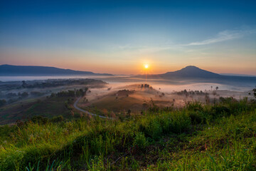 misty morning in the mountains with sunrise