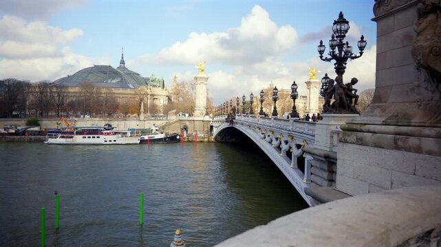 Seine River near Pont Alexandre III with ornate lamps boats and statues