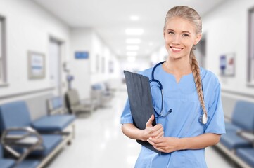 Portrait of happy nurse or doctor in hospital at work.