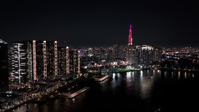 Ho Chi Minh City urban skyline at night with illuminated city lights, Vietnam