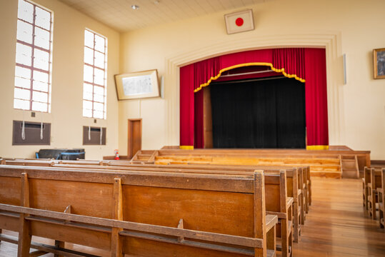 Historic Old Japanese Wooden School Auditorium with Flag