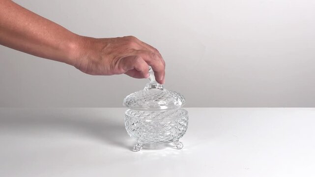 Video with real sound effect of  Glass lid placing on glass jar