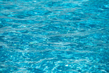 Obraz premium Ripped water in swimming pool. Surface of blue swimming pool, background of water.